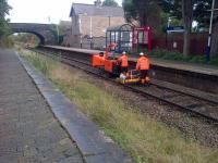 An unusual working captured on camera at Croston heading towards Preston on 16 October 2016. The Network Rail team were cutting down lineside vegetation during a T3 possession and their self propelled (although not a true RRV) shredding machine was very effective and converting plant material into a light mulch or chip.<br><br>[John McIntyre 16/10/2016]