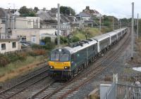 A short rake of Caledonian Sleeper stock was used to take Paralympian athletes from Manchester to Euston on 18th October 2016. The ECS was then worked back to Polmadie and is seen passing Hest Bank behind GBRf electric 92010.<br><br>[Mark Bartlett 18/10/2016]