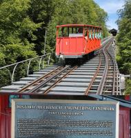 Geissbach Funicular was built in 1879 to transport guests and supplies from a steamer station on Lake Brienz 322' up to the hotel above. It was the first funicular in the world to use a single track with passing places rather than two parallel lines and as such, in 2015, the American Society of Mechanical Engineers designated it a Historic Mechanical Engineering Landmark.<br><br>[Mark Bartlett 20/06/2016]