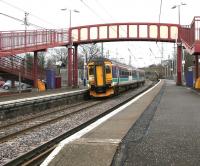 Platform view east at Curriehill station on a cold March morning in 2006 as ScotRail 156450 calls with a Glasgow Central - Edinburgh Waverley via Shotts service. <br><br>[John Furnevel 07/03/2006]