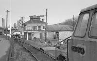 Derwenthaugh Coke Works on 21 April 1986, closed the previous year, served by the Chopwell & Garesfield Railway<br>
<br>
Looking north past a Sentinel shunter towards another diesel equipped with an air receiver.  The glazed building would appear to be a signal box or control office.<br><br>[Bill Roberton 21/04/1986]