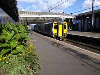 The Ayr - Girvan set bides it's at time at Ayr Platform 3 on a lovely 1 October.<br><br>[David Panton 01/10/2016]