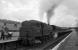 Fairburn 2-6-4T No. 42693 gets stuck in at the rear of what I believe is the 09:25 Crewe - Perth, as Duchess Pacific No. 46226 Duchess of Norfolk pulls away from Beattock station. August 1962.<br><br>[Bill Jamieson /08/1962]