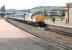 A northbound train about to call at platform 4 at Perth station in the early 1990s with what is thought to be an Edinburgh - Inverness service. The locomotive in charge is 37113 <I>Radio Highland</I> in BR Railfreight livery. [Ref query 4225]<br><br>[John Furnevel //]