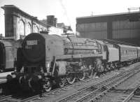 An unidentified Britannia Pacific, nameplate removed, stands with a train alongside platform 4 at Carlisle. The photograph is thought to have ben taken on 2 July 1966.<br><br>[K A Gray 02/07/1966]