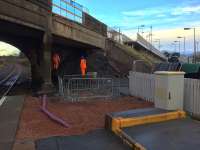 Preparatory work for the replacement overbridge at the south end of the Station Road bridge on 17th November 2016. The stairs and part of the access ramp have been removed and work continues above to relocate services on to the temporary pedestrian bridge [see image 56590].<br><br>[Colin McDonald 17/11/2016]