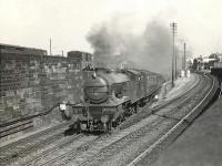 V3 67679 brings a Bridgeton Central - Drumry train off the branch at Bridgeton Central Junction, just east of High Street station, on 10 July 1957.   <br><br>[G H Robin collection by courtesy of the Mitchell Library, Glasgow 10/07/1957]