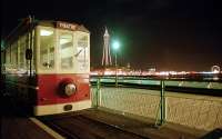Diesel tram parked at the Theatre end of the short pier tramway (1991 - 2004) with a notable tower in the backdrop. <br><br>[Ewan Crawford //2001]