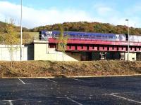 Approaching Galashiels from the south on 10 November 2016, the 1128 ex-Tweedbank crosses Currie Road bridge. Photographed looking north east from what must be the quietest car park in Gala. <br><br>[John Furnevel 10/11/2016]