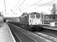 87020 <I>North Briton</I> heads a passenger service south through Leyland on 3rd December 1980. Rather unusually the train is on the Up Slow line. 87020 continued in BR/Virgin service until 2009 and has since been exported to Bulgaria. <br><br>[Mark Bartlett 03/12/1980]