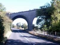 The impressive skew arch viaduct that once carried the Border Counties line over the A6079 a quarter of a mile south of Chollerton station, seen here in November 2007. [Ref query 178].<br><br>[John Furnevel 05/11/2007]