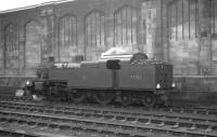 The Carlisle station pilot taking a break alongside the west wall on a Saturday morning in March 1964. Duty locomotive on this occasion is Fowler 2-6-4T 42353, finally withdrawn from Kingmoor shed three months later.<br><br>[K A Gray 14/03/1964]