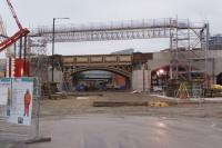 Looking north along Water Street with the first bridge carrying the Ordsall Jct (left) to Castlefields Jct line. The viaduct here is being widened to accommodate the south end of the new Ordsall Chord and two new bridge sections are waiting in a compound to the right to be lifted into place, possibly during an extended closure over Christmas and New Year, starting on the 18th.<br><br>[John McIntyre 15/12/2016]