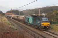 DRS 68023 <I>Achilles</I> heads south on the WCML at Woodacre with a <I>Northern Belle</I> luxury excursion from York on 16th December 2016, This ran out via the Little North Western route to Carnforth and returned over the Copy Pit line. Classmate 68016 <I>Fearless</I> was on the rear of the train. <br>
<br><br>[Mark Bartlett 16/12/2016]