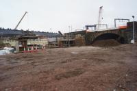 Bridges over the Irwell. The horizontal grey beam on the left is the start of the new bridge that will carry the Ordsall Chord over the river. On the right however is the original Stephenson bridge of the Liverpool and Manchester Railway. The missing parapet and cleaner stone was due to a later bridge being connected to it and only having recently been removed during the Ordsall Chord work.<br><br>[John McIntyre 15/12/2016]
