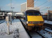 91017, with National Express branding over GNER livery, is seen newly arrived from Kings Cross in the snow at Leeds on 3rd February 2009. <br><br>[Mark Bartlett 03/02/2009]