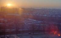 Low winter sun and flare in 1991. The site of Hyndland EMU depot, Hyndland station [1st] and the Lanarkshire and Dumbartonshire being redeveloped. The view is from Gartnavel General Hospital. The nearby Bingham's Pond was frozen.<br><br>[Ewan Crawford //1991]
