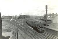 Fairburn 2-6-4T 42191 runs through Holm Junction on 24 May 1960 with a Largs - St Enoch train. At that time the locomotive was allocated to Ardrossan shed (67D), which stands in the background.<br><br>[G H Robin collection by courtesy of the Mitchell Library, Glasgow 24/05/1960]