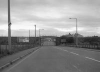 Looking south west along the A6094 towards Whitecraig, with the former Gifford/Dalkeith Colliery branch crossing over. 1978.<br><br>[Bill Roberton //1978]
