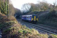 A New Year's Day service from Bolton to Blackpool exits the cutting at the west end of the Chorley Tunnel. Recent vegetation removal in preparation for electrification has opened up this view.<br><br>[John McIntyre 01/01/2017]