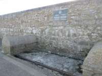 A section of track on Porthcawl Harbour wall.<br><br>
The plaque reads,<br><br>
'The Duffryn Llynvi and Porthcawl Railway Company 1825 - 1860<br><br>
The dock and horsedrawn tramroad from Duffryn Llynfi and Maesteg built by the company provided the outlet to the sea for the early iron and coal industries The rails below are the last section of the tramroad still in position.'<br><br>[Alastair McLellan 02/01/2017]
