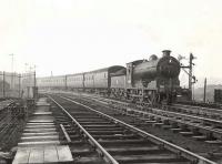 A workmen's train negotiates the north to west curve at Cowlairs in September 1954. The locomotive is class J37 0-6-0 64633, built at Cowlairs Works in 1921 and a lifetime resident of nearby Eastfield shed.   <br><br>[G H Robin collection by courtesy of the Mitchell Library, Glasgow 28/09/1954]
