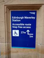 This notice at the foot of the stairs on the Calton Road entrance to Waverley and is aimed at wheelchair users. I can't help thinking though that anyone who needs to be told to turn left for 1 metre must be so short-sighted that they couldn't even see the notice, let alone read it ...<br><br>[David Panton 07/01/2017]