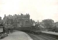 Ex-Caledonian 0-4-4T 55156 draws to a halt at Kelvin Bridge station on 14 September 1951. The city bound train has recently emerged from the tunnel that brought the Glasgow Central Railway below Great Western Road from Botanic Gardens. The road bridge carrying the A82 is on the right with Kelvinbridge Subway station just out of shot. For the platform view 54 years later [see image 4695].   <br><br>[G H Robin collection by courtesy of the Mitchell Library, Glasgow 14/09/1951]