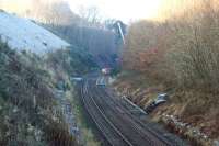 The Settle and Carlisle Railway was closed in early 2016 due to a landslip at Eden Brows between Armathwaite and Cumwhinton. Network Rail and their contractor Story have constructing an enormous concrete and steel structure that will sit beneath the railway. They are also carrying out significant ground stabilisation between the railway and the River Eden some 70 metres below the line. This view from an overbridge to the south of the site shows the track removed in the distance beyond the yellow container. The line is scheduled to reopen on 31 March 2017.<br><br>[John McIntyre 21/01/2017]