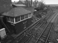 Ashington signal box looking north in 1987. The line to the left ran to Ashington Colliery and the Butterwell Disposal Point. Seldom used, the connection has been severed allowing box closure in 2010. The double track to the right ran to the Lynemouth Aluminium Smelter and Lynemouth Power Station, having started life as the Newbigging Branch.<br><br>[Bill Roberton //1987]
