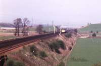 A photograph of the last train (1350 Glasgow Central to Ardrossan Harbour) to use the Down (formerly Up) Slow on Saturday 27/10/84. It is approaching No 49 Down Slow Outer Home at clear. The view is looking north.<br>
<br>
From Sunday 28/10/84 the Down and Up Slow lines were cut back<br>
to their present location at Swinlees.<br><br>[Donald Hillier 27/10/1984]