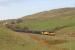 Colas 60096 has just lifted the empty bitumen tanks from Preston Dock over the Copy Pit summit and is now starting the winding descent to Hall Royd Jcn near Todmorden on 31st October 2016.<br><br>[Mark Bartlett 31/10/2016]