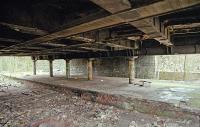 Under Clarence Drive the southern portion of Crow Road's island platform is seen in 1999. Ahead the line ran via Crow Road Tunnel to Partick North Junction. Off to the right the station site is obliterated by a housing development.<br><br>[Ewan Crawford //1999]