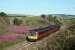 107738 passing the site of Glenburnie Junction on 24th July 1990. My late uncle was a signalman here and worked the final shift in April 1960. The trackbed of the former route to St Fort is to the left.<br><br>[Graeme Blair 24/07/1990]