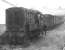 Shunting operations in progress at Selkirk in 1964. The branch from Galashiels closed completely that year, with the last freight running on 30 October. Gary Straiton adds: the driver is either Tam Howeson (we're not sure about the spelling) or Andrew Butler (ex St. Boswells). The shunter / guard is 'Heb' Romanis.<br><br>[Dougie Squance (Courtesy Bruce McCartney) //1964]