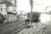 BR Standard light Pacific no 72009 <I>Clan Stewart</I> brings the 7.25am Stranraer - Glasgow train over Dunragit level crossing on 16 July 1956.<br><br>[G H Robin collection by courtesy of the Mitchell Library, Glasgow 16/07/1956]