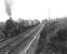 Horwich Mogul 42918 with a westbound goods at a wet and lonely Loch Skerrow station on 14 July 1956. The train is on the up line at this point to permit overtaking. [Ref query 678]  <br><br>[G H Robin collection by courtesy of the Mitchell Library, Glasgow 14/07/1956]