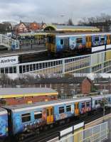 Definitely one of the better advertising vinyls. Merseyrail 508111 sports full length images promoting <I>The Beatles Story</I> attraction in Liverpool. Each of the three coaches is different leading to a very eye catching train. Seen here at Aintree on 7th February 2017 with the famous racecourse just behind the station. <br><br>[Mark Bartlett 07/02/2017]
