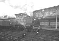 Scene at Carlisle platform 4 on the morning of Saturday 22 December 1962. Stanier Coronation Pacific no 46245 <I>City of London</I> has just taken over the 9.56 am ex-Glasgow Central for the next leg of its journey to Euston. <br><br>[K A Gray 22/12/1962]