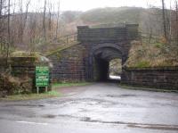 Looking at a very well built, and still in use, underbridge running through the embankment of the former Woodhead line a short distance to the west of Crowden station on the section to Hadfield.<br><br>[David Pesterfield 18/01/2017]