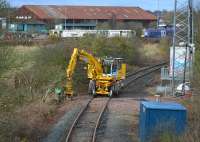 The Inverkeithing North/East chord with a road-rail machine and DR73803 waiting for the call to work at the Aberdour track renewal. A 170 passes on a diverted service.<br><br>[Bill Roberton 19/03/2017]