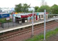The station building on the Glasgow bound platform at Hillington West, looking from the footbridge towards the industrial area to the north of the station on a quiet Sunday morning in the spring of 2007. Four tracks ran through the station, although at this time there were only two. [In 2011 this was increased to three.]<br><br>[John Furnevel 20/05/2007]