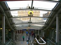 The cross station walkway at Waverley seen from the south entrance on Market Street during the morning of Friday 24 March 2017. The former North British Hotel (nowadays the Balmoral) overlooks the scene from its position on Princes Street alongside Waverley Steps (now also equipped with escalators) on the  north side of the station. [See image 37241]<br><br>[John Furnevel 24/03/2017]