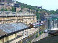 A ScotRail 158 arrives at Waverley's 'sub' platform 20 on June 2006 from Newcraighall with a through service to Dunblane. On the right work is underway on the IECC extension to the Edinburgh Signalling Centre. [See image 9633]<br><br>[John Furnevel 08/06/2006]