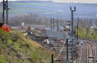 Looking south along the former Waverley Route.  The course of the facing junction and line into the new electric depot are taking shape on the left, while a 66 with the North Blyth - Fort William alumina train is stopped due to a landslip in the Glasgow area. 4 April.<br><br>[Bill Roberton 04/04/2017]