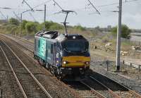 After two days of loaded test trains new DRS electro diesel 88002 <I>Prometheus</I> returned to light engine running on 5th April 2017. The loco, with pantograph rising for the Hest Bank crossing, is seen returning to Carlisle after a trip to Crewe. <br><br>[Mark Bartlett 05/04/2017]