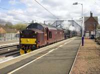 WCRC 37518 leads Black 5s 45212 and 45407 north through Uddingston on 10 April 2017 with <I>the Jacobite</I> on an empty carriage movement from Carnforth to Fort William. <br><br>[Colin McDonald 10/04/2017]