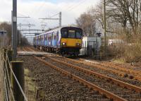 Dumbarton Central to Cumbernauld passing over Greenfoot Level Crossing (3/3/17).<br><br>[Alastair McLellan 03/03/2017]