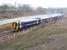 Running through Newcraighall South Junction onto the single line section on 22 January 2017 is the rainsoaked ScotRail 0945 Tweedbank - Edinburgh Waverley. The train is slowing for its next stop at Newcraighall station, located on the other side of the bridge carrying Whitehill Road. Running along the top left of the picture, just beyond the tree line, is the road that now links the the Biogen anaerobic digestion facility, opened last year, with Whitehill Road. [See image 51265]<br><br>[John Furnevel 22/01/2017]