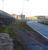 Looking north from the level crossing over the A429 Brielle Way [see image 58002] on the approach to Sheerness on Sea, along a surviving section of the former docks branch. The dock wall is built across the line just by the building ahead. The dock area is to the left and the former Sheerness Steel site across the road to the right.<br><br>[David Pesterfield 24/01/2017]